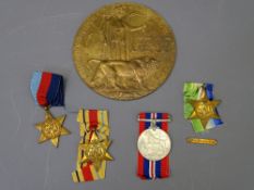 WWII MEDALS GROUP OF FOUR and a WWI death plaque, the medals all unmarked consisting of a 1939-