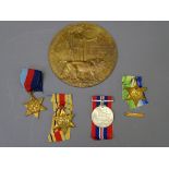 WWII MEDALS GROUP OF FOUR and a WWI death plaque, the medals all unmarked consisting of a 1939-