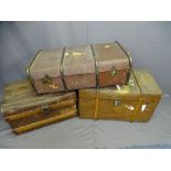THREE VINTAGE TRAVEL TRUNKS including a deep canvas type example with wooden banding, 62cms H, 84cms
