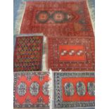 FIVE PERSIAN/MIDDLE EASTERN SCATTER RUGS, all having traditional repeat, all block patterns on red