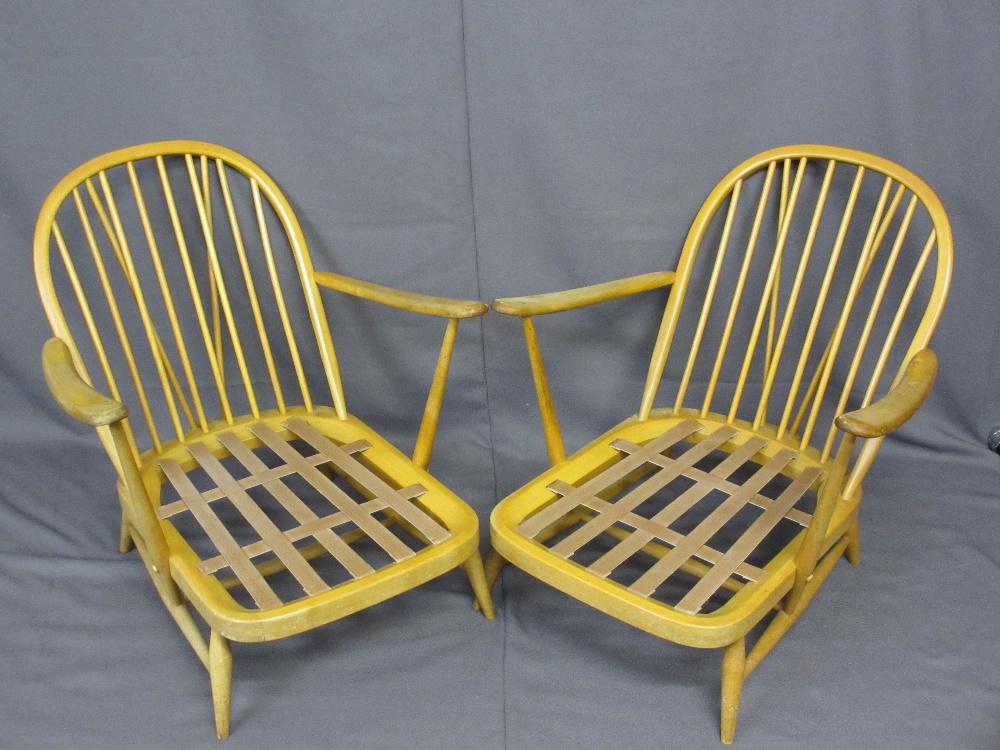 LIGHT ERCOL ARMCHAIRS, a pair having stick backs with hooped tops