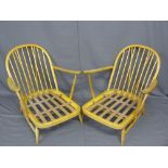 LIGHT ERCOL ARMCHAIRS, a pair having stick backs with hooped tops