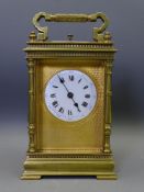 FRENCH BRASS CARRIAGE CLOCK REPEATER retailed by Harrods, London, having a fine gilt mask and