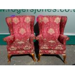 VINTAGE PARKER KNOLL WING-BACK ARMCHAIRS, a pair in wine colour upholstery with floral embossed