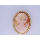 LARGE 9CT GOLD SHELL CARVED CAMEO BROOCH with safety chain of a young woman in profile, 16.5grms