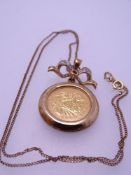 ROYAL MINT 'ETERNAL LOVE' PENDANT, 2005 half sovereign necklace, 9ct gold mounted with fine link