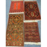 FOUR EASTERN/PERSIAN STYLE SCATTER RUGS, all red ground with traditional repeating block patterns