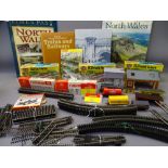 Box of Hornby, Air fix and Fleischmann 00 gauge track and models, some constructed, some in boxes,