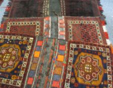 THREE MIDDLE EAST/PERSIAN STYLE CARPET CAMEL BAGS, mixed red and blue ground with various bordered