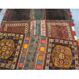 THREE MIDDLE EAST/PERSIAN STYLE CARPET CAMEL BAGS, mixed red and blue ground with various bordered