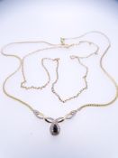 TWO 9CT GOLD NECKLACES including a fine link example, 45cms L and a flat link necklace with two tone