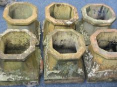 SIX MATCHING TERRACOTTA CHIMNEY POTS, 39cm heights, 36 x 36cm bases