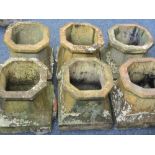 SIX MATCHING TERRACOTTA CHIMNEY POTS, 39cm heights, 36 x 36cm bases