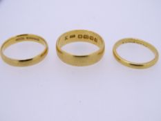 THREE 22CT GOLD WEDDING BANDS, ring size H (misshapen), M and mid K-L, 10grms gross