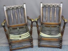 PRIORY STYLE CARVED OAK EASY CHAIRS with loose cushion tapestry type upholstery, 80cms H, 70cms W,