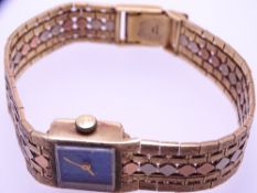 9CT GOLD OPAL DIAL LADY'S WRIST WATCH with tri-colour integral strap, 28grms gross