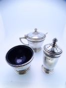 SILVER THREE PIECE CONDIMENT SET, Birmingham 1935, consisting open salt with blue glass liner,