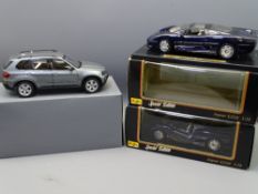 THREE 1/18TH SCALE DIECAST COLLECTOR'S VEHICLES including a BMW X5 by Kyosho and two Jaguar XJ220