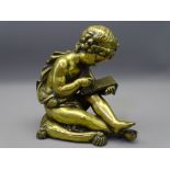 ORNAMENTAL FIGURINE OF A YOUNG SCRIBE in cast brass/polished bronze depicting a young boy seated