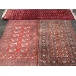 THREE PERSIAN/EASTERN WOVEN SILK & WOOLLEN CARPETS, various red grounds with similar repeat block