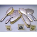 FIVE PIECE SILVER DRESSING TABLE HAND MIRROR & BRUSH SET with a further non-matching hand mirror and
