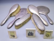 FIVE PIECE SILVER DRESSING TABLE HAND MIRROR & BRUSH SET with a further non-matching hand mirror and