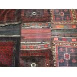 THREE MIDDLE EAST/PERSIAN TYPE CAMEL BAGS, red ground mainly with traditional block patterns and