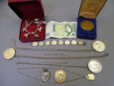 SILVER MOUNTED COINS, FOBS, CHARM BRACELET and other items of interest to include a bracelet of 8