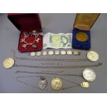 SILVER MOUNTED COINS, FOBS, CHARM BRACELET and other items of interest to include a bracelet of 8