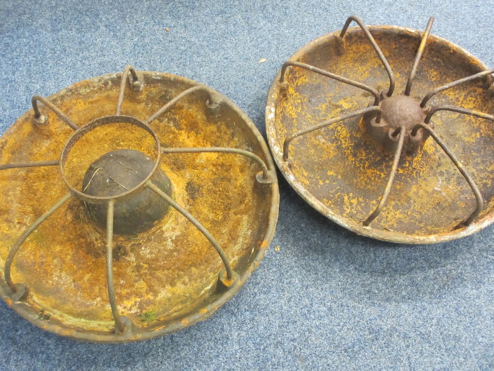 TWO CIRCULAR CAST IRON PIG FEEDERS, 75 and 70cm diameters