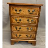 REPRODUCTION YEW WOOD FOUR DRAWER CHEST, neatly proportioned with swan neck handles and cross-banded