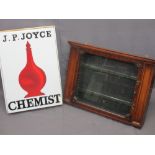 J P JOYCE CHEMIST SIGN and an Edwardian mahogany chemist's wall cabinet with single glazed door