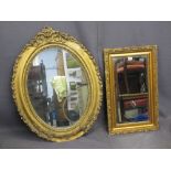 TWO GILT FRAMED WALL MIRRORS to include a pine and gesso moulded oval example with leaf and floral