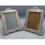 CHESTER 1913/1914 PAIR OF SHAPED SILVER PICTURE FRAMES, 20cms tall (A/F)