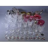 GLASSWARE - a quantity of drinking glasses, Cranberry glassware ETC, also a four piece silver