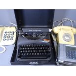 REMINGTON RAND VINTAGE TYPEWRITER IN A CASE and a quantity of old telephones