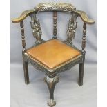 JACOBEAN STYLE CARVED OAK CORNER ARMCHAIR with drop-in rexine covered seat pad, 79cms H, 73cms W,