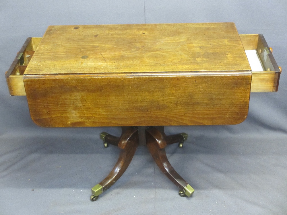 LATE REGENCY MAHOGANY TWIN-FLAP PEDESTAL TABLE with end drawers having turned wooden knobs, turned