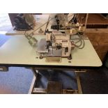 BROTHER HIGH SPEED OVERLOCK INDUSTRIAL TYPE SEWING MACHINE, Model No EF4-B531 on workbench with