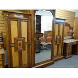 GOOD LATE VICTORIAN 'AESTHETIC' STYLE BEDROOM SUITE, floral carved panelled cupboards with brass