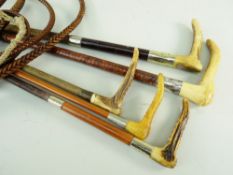 FIVE VINTAGE HUNTING CROPS / WHIPS, three with antler handles, one with silver collar, two steel