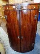 GEORGE III MAHOGANY EBONY STRUNG & MARQUETRY BOW FRONT HANGING CORNER CUPBOARD, 110cms high