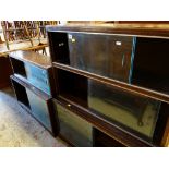 TWO STAINED OAK BOOKCASES with sliding glass doors, 89cms wide (2)