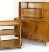 ERCOL OCCASIONAL FURNITURE comprising pale oak sideboard, tea trolley 71cms wide and wall shelf