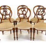 SET OF VICTORIAN WALNUT BALLOON BACK DINING CHAIRS, leaf carved C-scrolled splats, stuffover