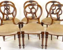 SET OF VICTORIAN WALNUT BALLOON BACK DINING CHAIRS, leaf carved C-scrolled splats, stuffover