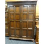 WARING & GILLOW 17TH CENTURY-STYLE PANELLED OAK WARDROBE, fitted interior, 138cms wide