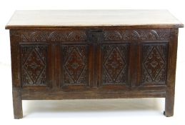 LATE 17TH CENTURY JOINED OAK COFFER, boarded top with reed edge above arcaded frieze and lozenge