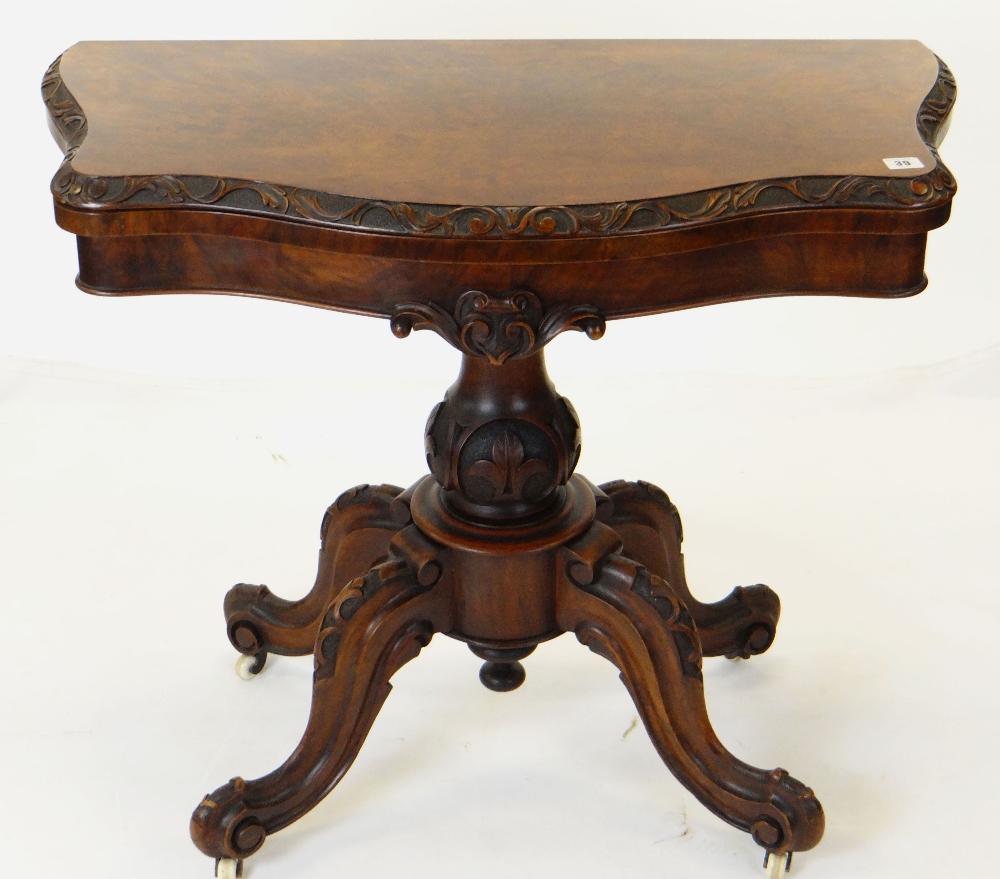 MID-VICTORIAN CARVED WALNUT SERPENTINE CARD TABLE, foldover top above baluster column and four - Image 3 of 3