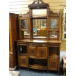LATE VICTORIAN WALNUT PARLOUR CABINET with glazed and mirrored superstructure, above bow front base,
